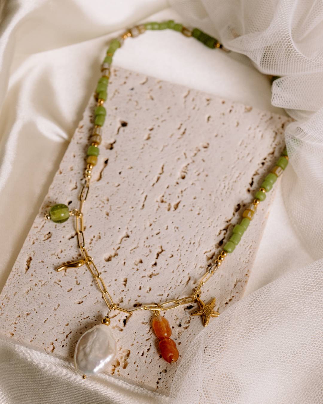 Handcrafted beaded necklace with gold plated paperclip chain and customisable jewellery charm