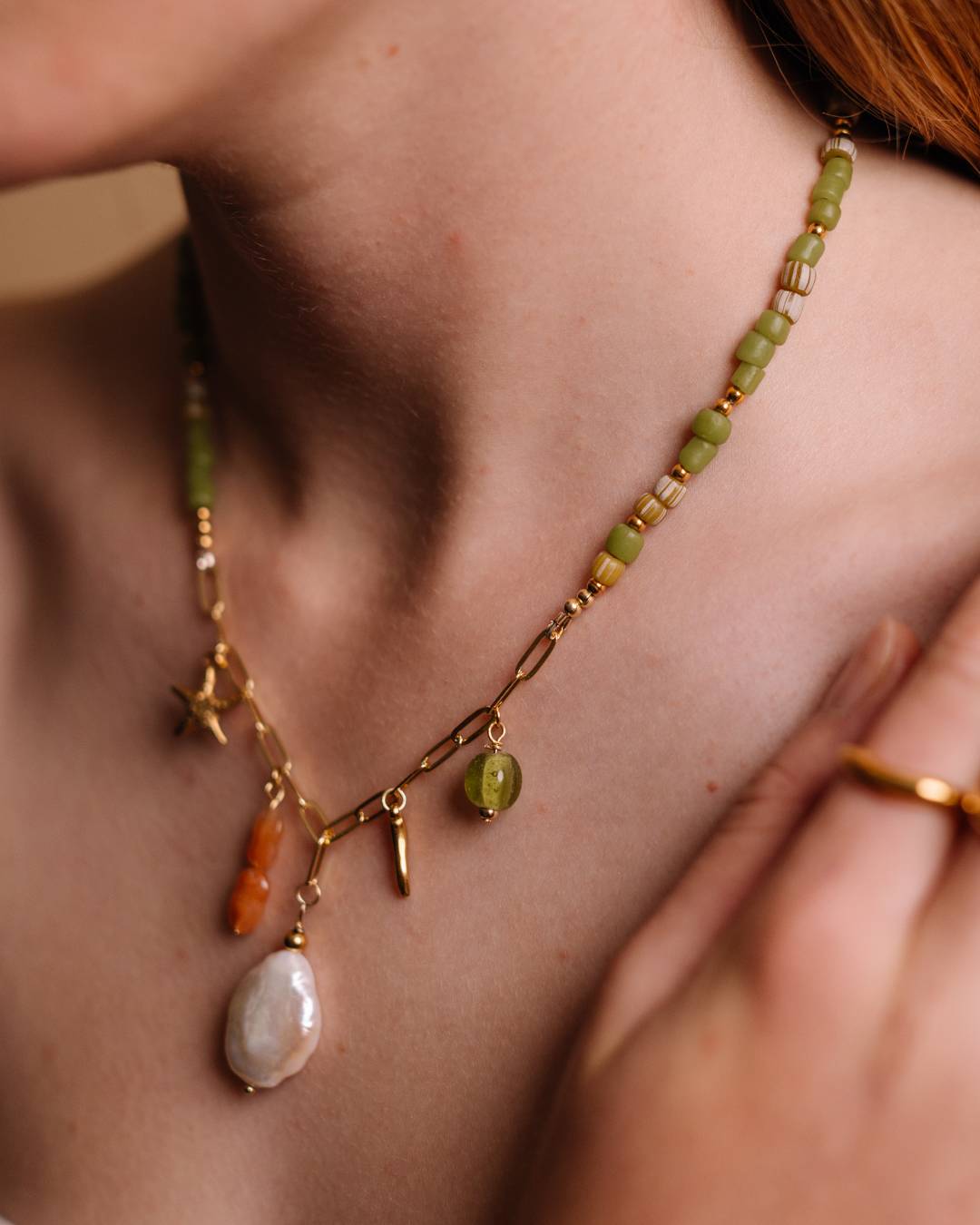 Handcrafted beaded necklace with gold plated paperclip chain and customisable jewellery charm