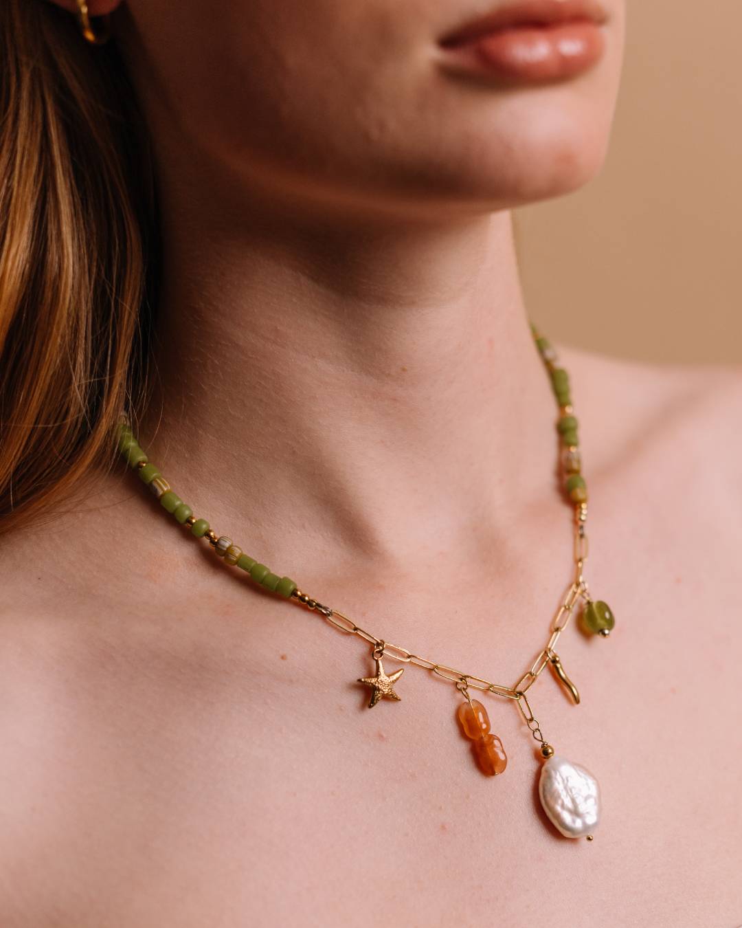 Handcrafted beaded necklace with gold plated paperclip chain and customisable jewellery charm