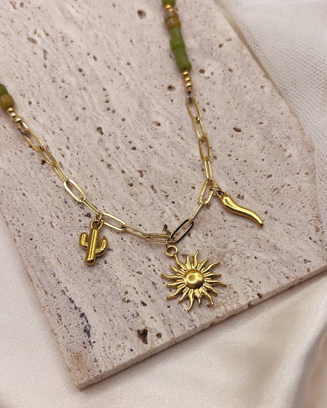 Handcrafted beaded necklace with gold plated paperclip chain and customisable jewellery charm