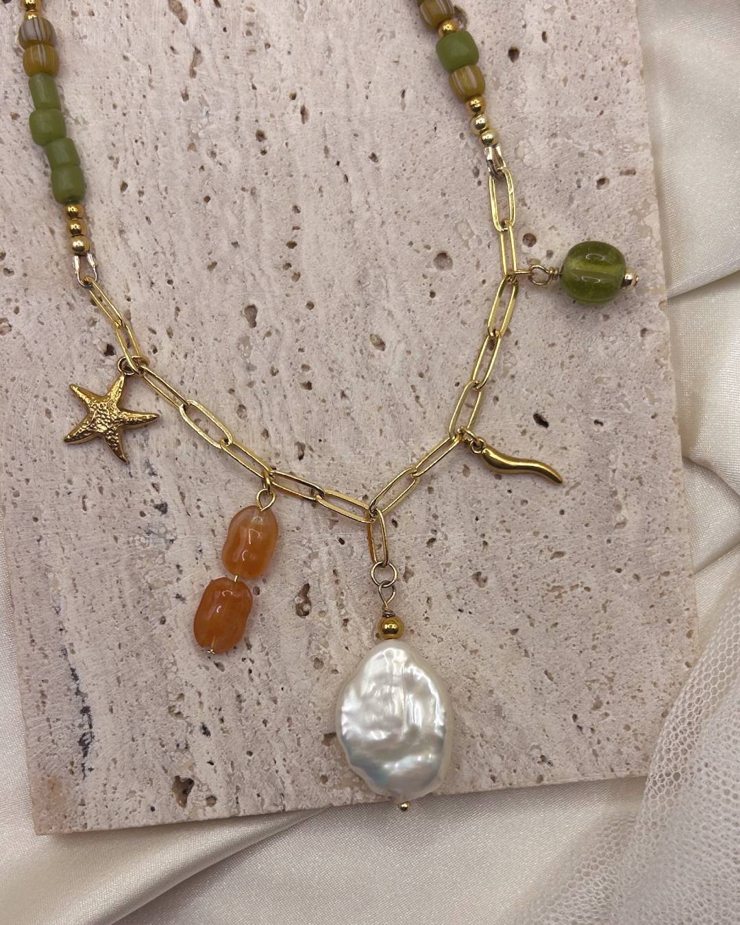 Handcrafted beaded necklace with gold plated paperclip chain and customisable jewellery charm