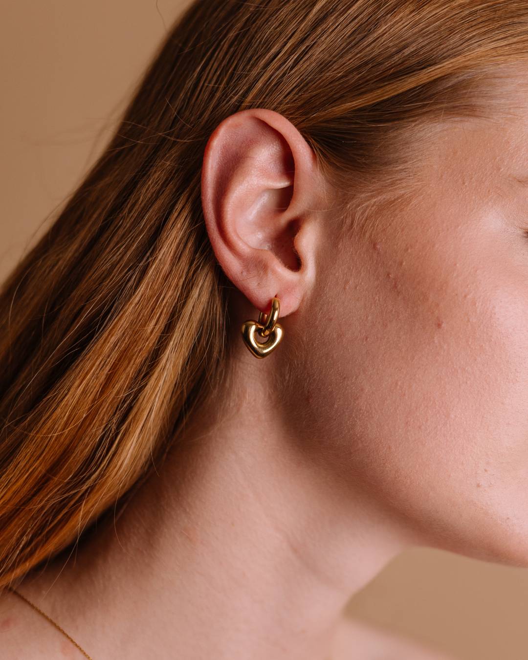 Waterproof gold plated huggie hoop earring with removable heart charm